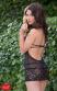 Chemise nera in tulle con inserti in pizzo.