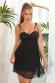 Vestito nero coprente con tulle, paillettes e perline.