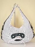 Borsa bianca con pois neri.