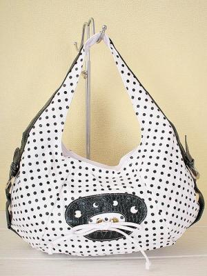 Borsa bianca con pois neri.