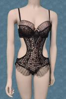 Body in microrete ricamata con volants. Beige-nero