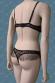 Body in microrete ricamata con volants. Beige-nero