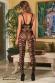 Catsuit con intagli irregolari ed inserti a rete.